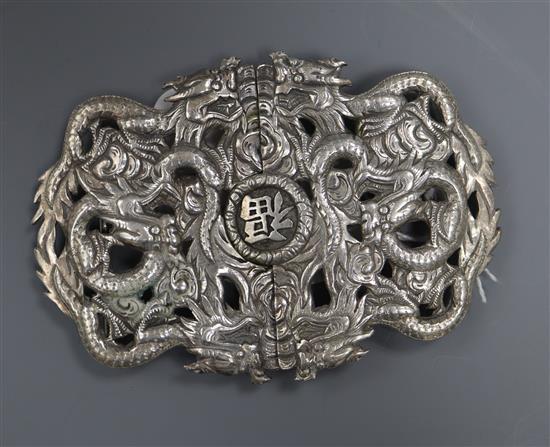 A Chinese Export white metal dragon belt buckle, by Luen Wo, 10.2cm.